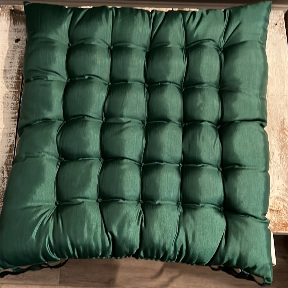 Dress up any table with these beautiful tufted silk chair cushions.